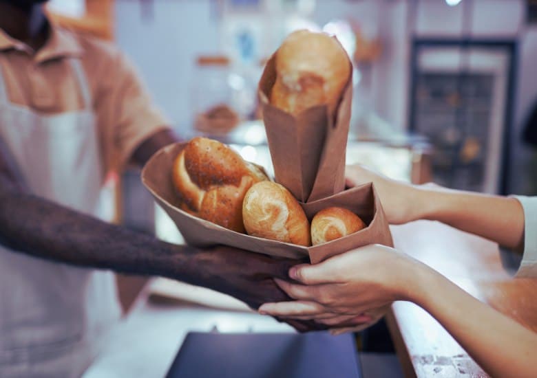 buying bread from a baker