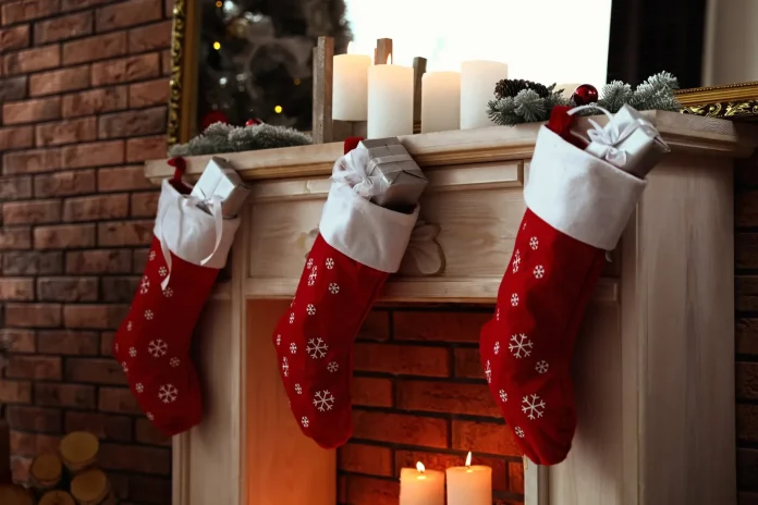 Christmas stockings hung by a brick fireplace