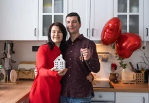 Couple holding the keys to their new home