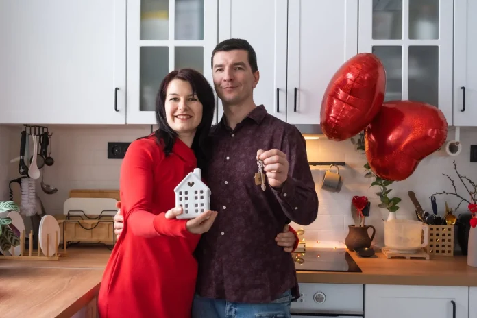 Couple holding the keys to their new home