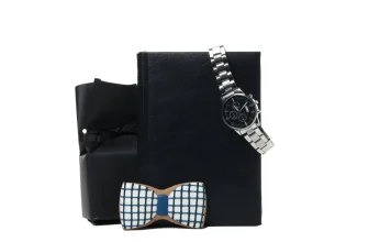 50+ Luxury Christmas Gifts For Him Over $1000 Luxury gift set for men with a wristwatch and wooden bow tie on a black gift box