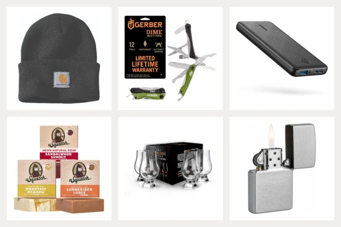Stocking stuffers for men including a Carhartt beanie, Gerber Dime multitool, Anker power bank, Dr. Squatch soap, Glencairn whisky glasses, and a Zippo lighter